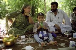  In the Panshir valley, a kabouli family during a picnic next to the river Jabal Saraj