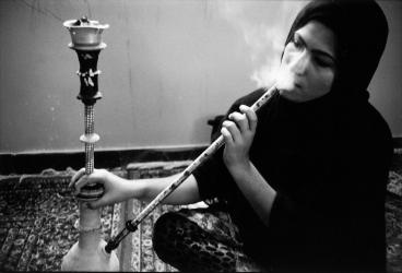  Ismat is at home and got two child. When her husband who is bus driver goes to work, she starts smoking narghile. Bandar Lenghe, South of Iran.
